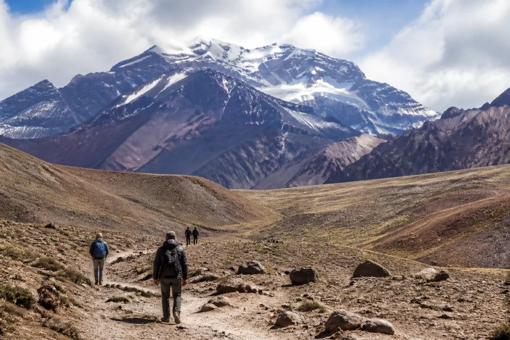 Day visitors walking near Horcones with Aconcagua in the background