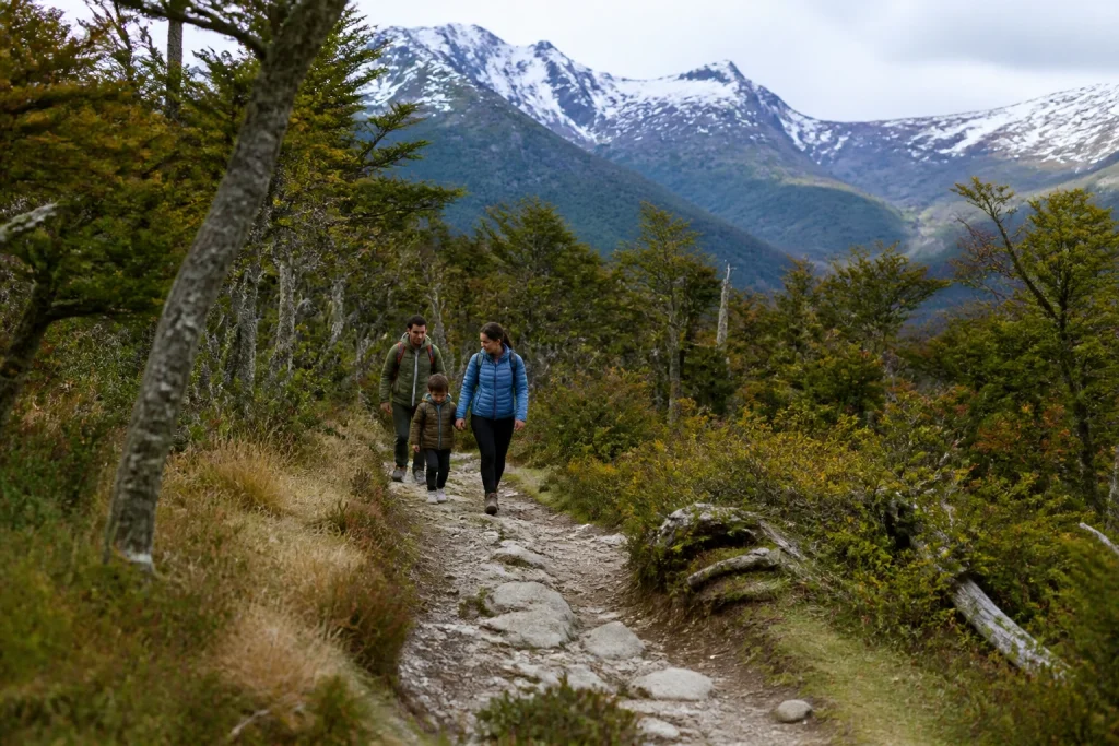 Family walking on a forest trail in Tierra del Fuego National Park