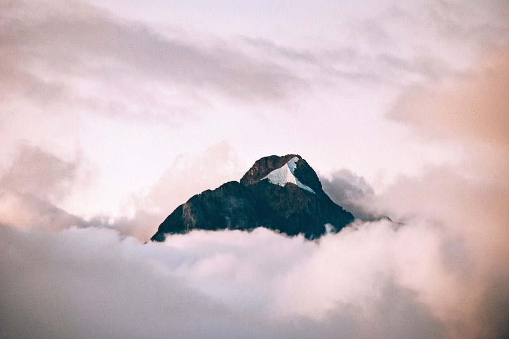 A high Andean peak rising above clouds on Peru's Inca Trail