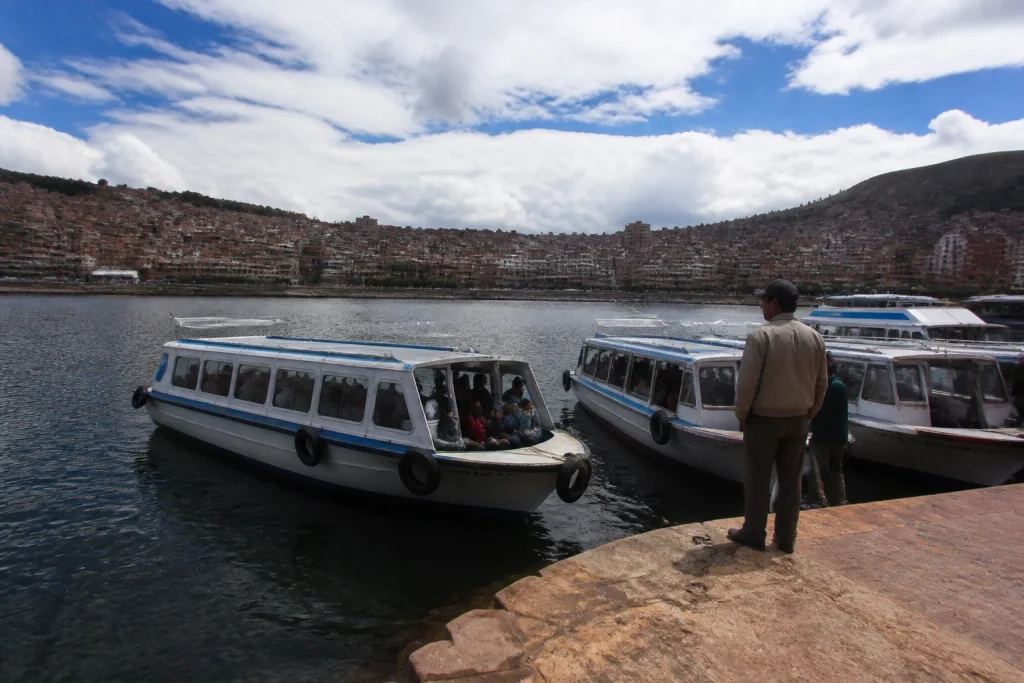 Waterfront and passenger boats at the Lake Titicaca port in Puno