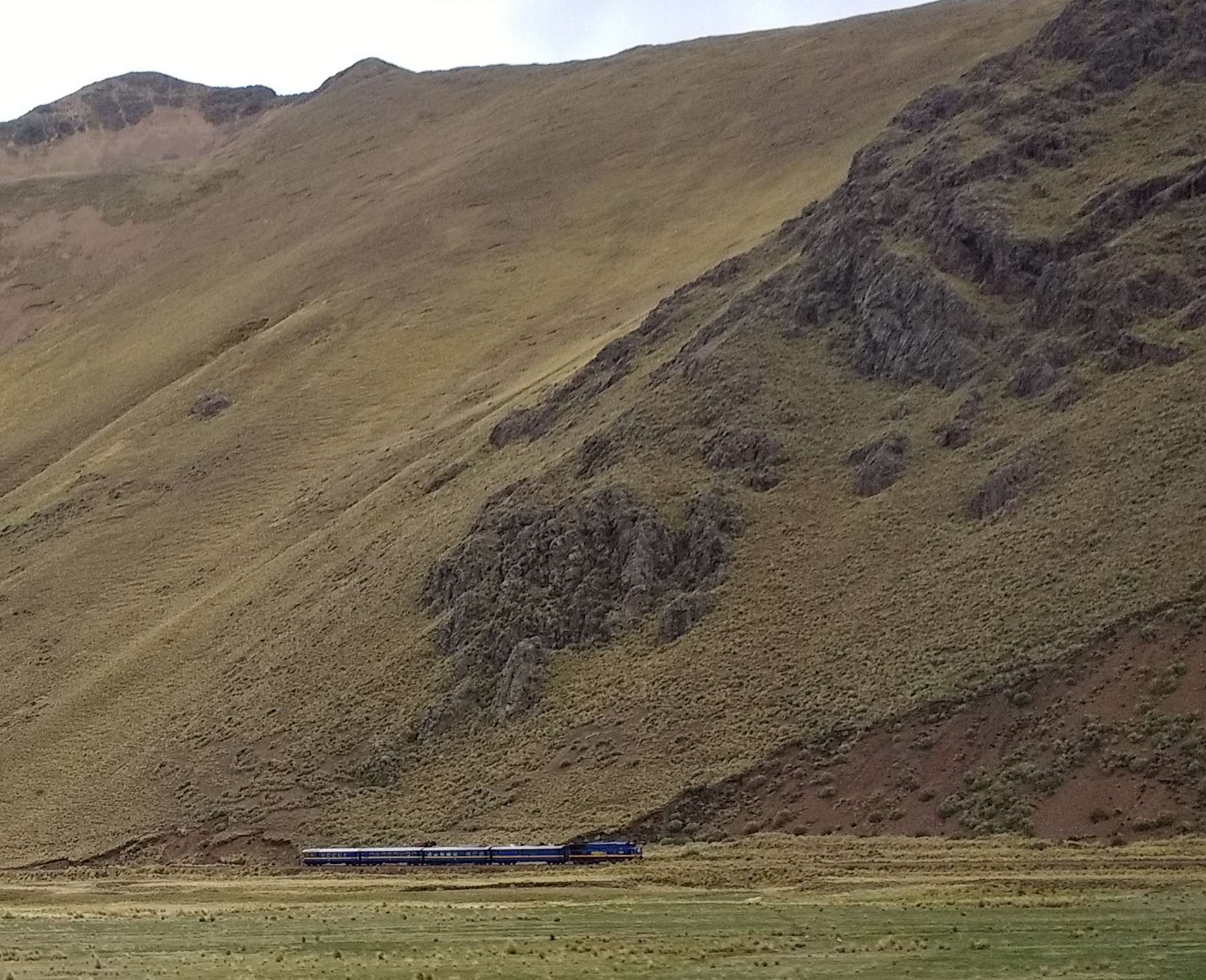 An Andean railway winding through a mountain valley