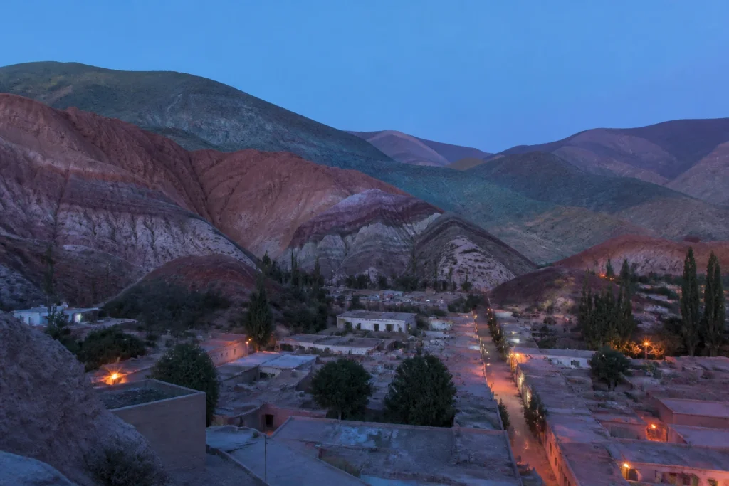 Purmamarca and its multicolored Andean landscape at dusk
