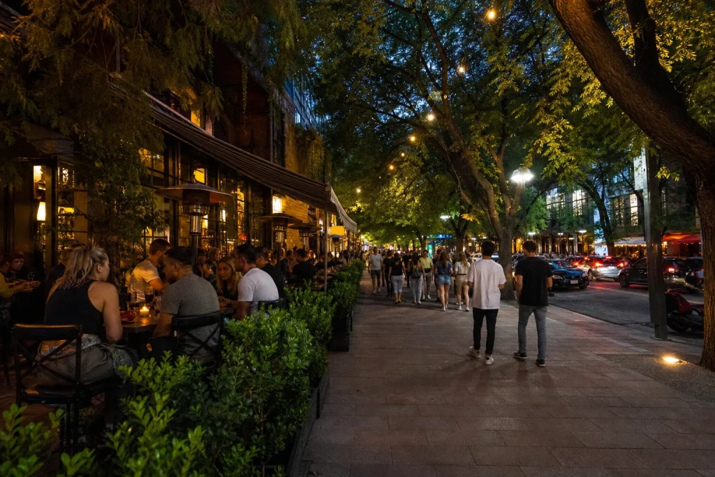 Evening restaurant and bar terraces along Avenida Arístides Villanueva in Mendoza