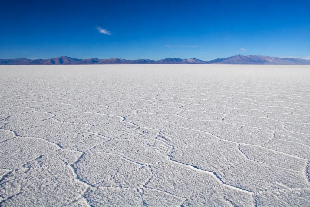 White salt crust and wide horizon at Salinas Grandes in Jujuy, Argentina