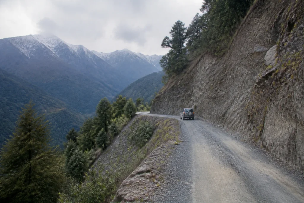 Vehicle on a remote mountain road in an Argentine national park.