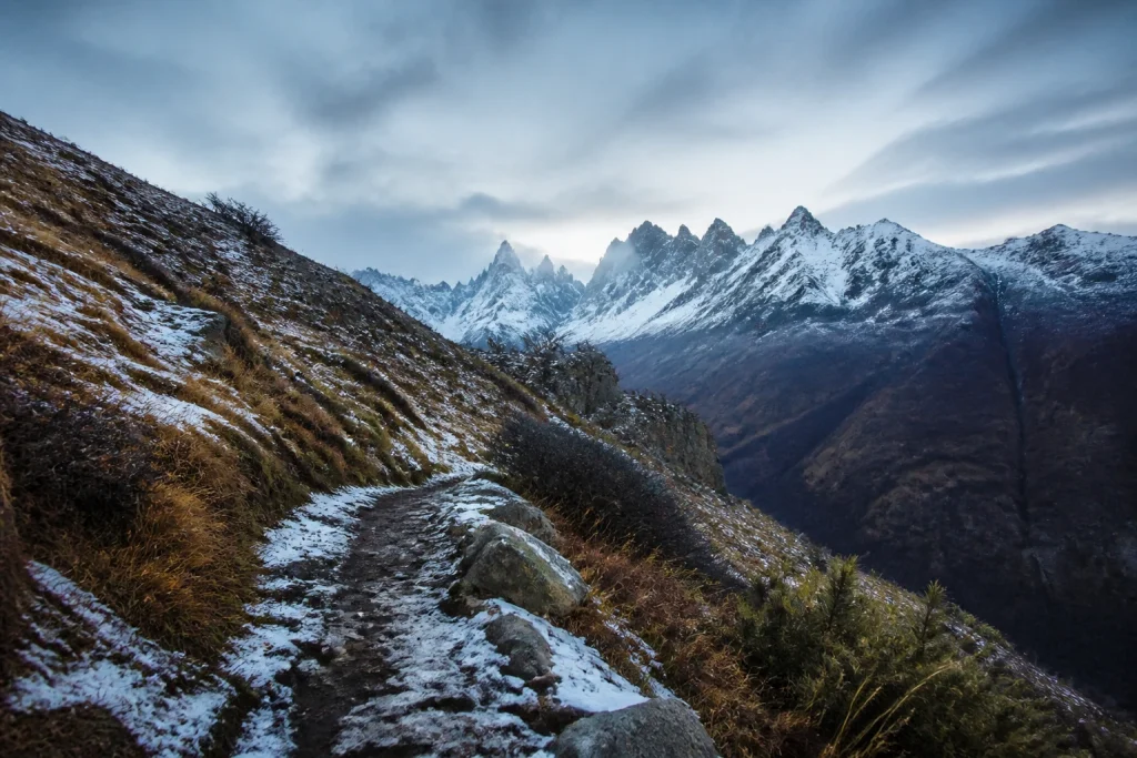 Snow-dusted mountain trail in Argentine Patagonia during winter.