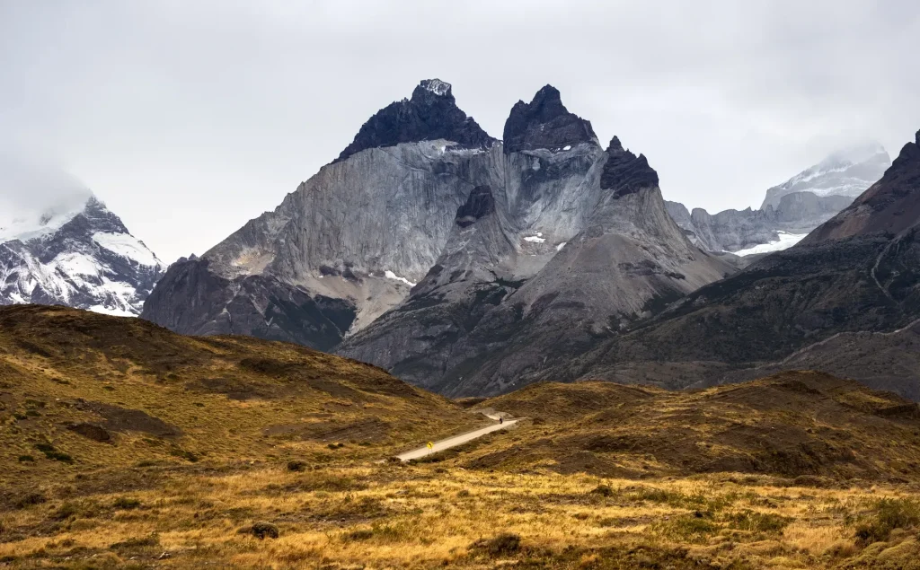 A scenic vehicle route with views of the Paine Massif in Torres del Paine.